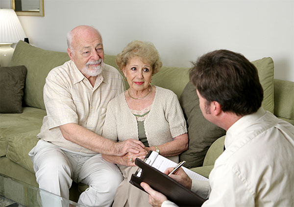 A Senior Couple Talking with a Cemetery Manager